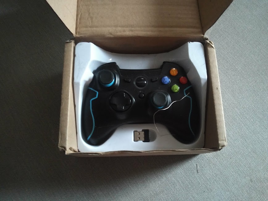 EasySMX Wireless Controller opened box showing an Xbox 360 controller with wireless USB adapter
