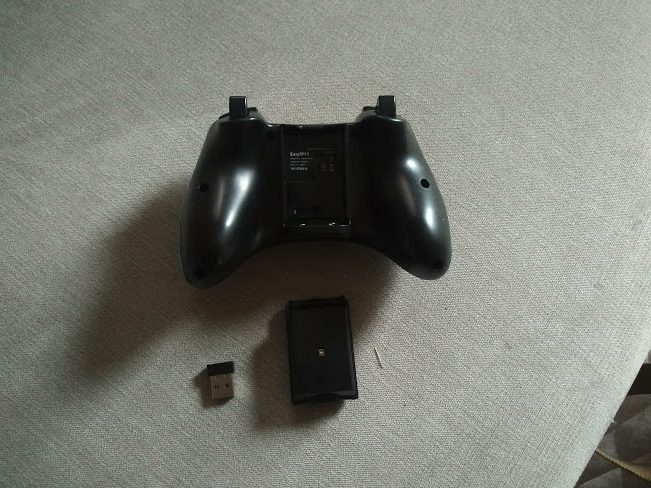 EasySMX Wireless Controller out of box showing an Xbox 360 controller with wireless USB adapter and battery pack