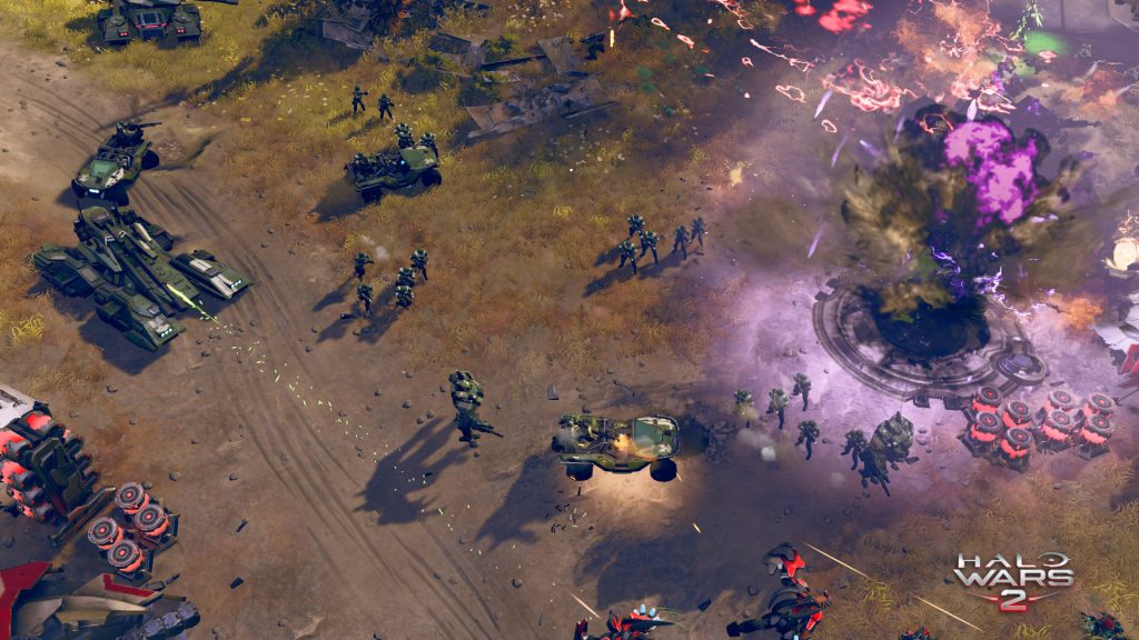 Halo Wars 2 gameplay showing a massive attack on a covenant base
