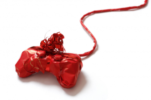 Playstation controller in red wrapping paper.