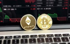 Ethereum and Bitcoin cryptocurrency sitting on a laptop, these currencies usually offer faster payout speeds from certain places compared to traditional retailers