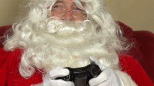 Santa playing video games at Christmas