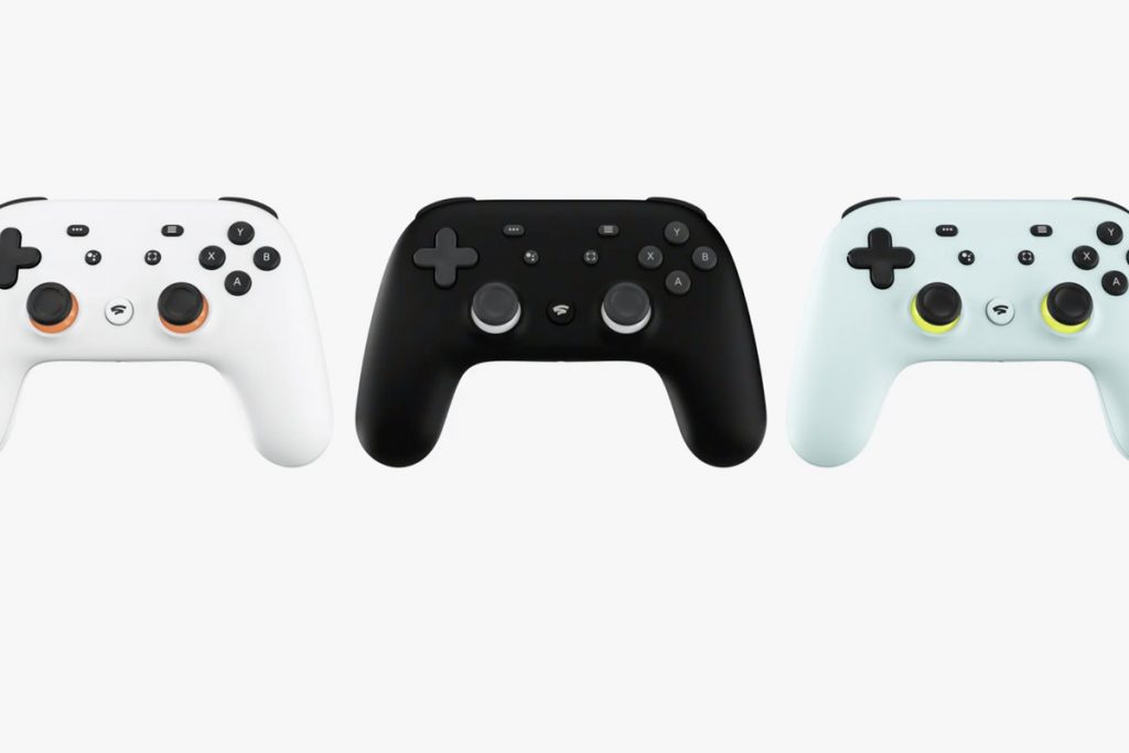 Google Stadia Controller in white, Black and what looks like mint choc chip green