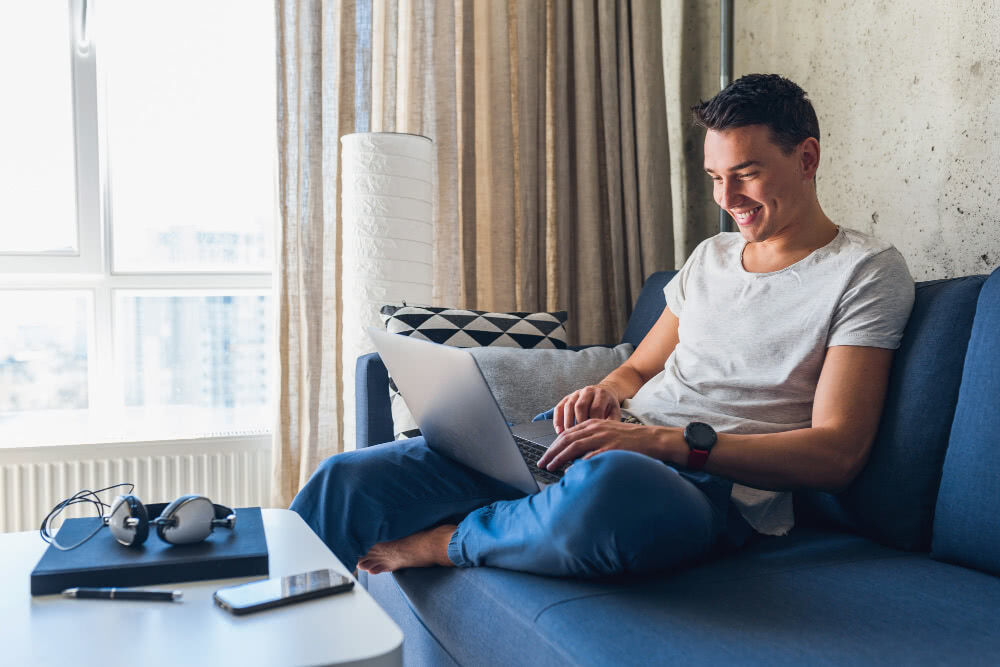 Young attractive man using the internet wearing a smartwatch