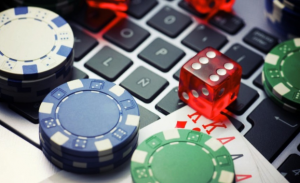 Software is used for online gambling at Online Casino Sites and Games poker chips and dice on laptop