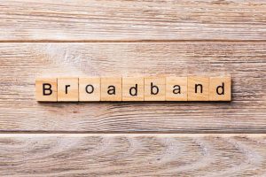 Broadband spelt out in small wooden tiles with letters on