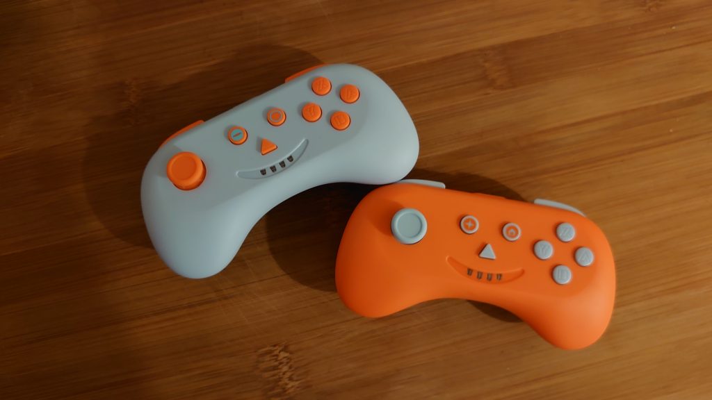White and Orange MULTI:PLAYCON controllers