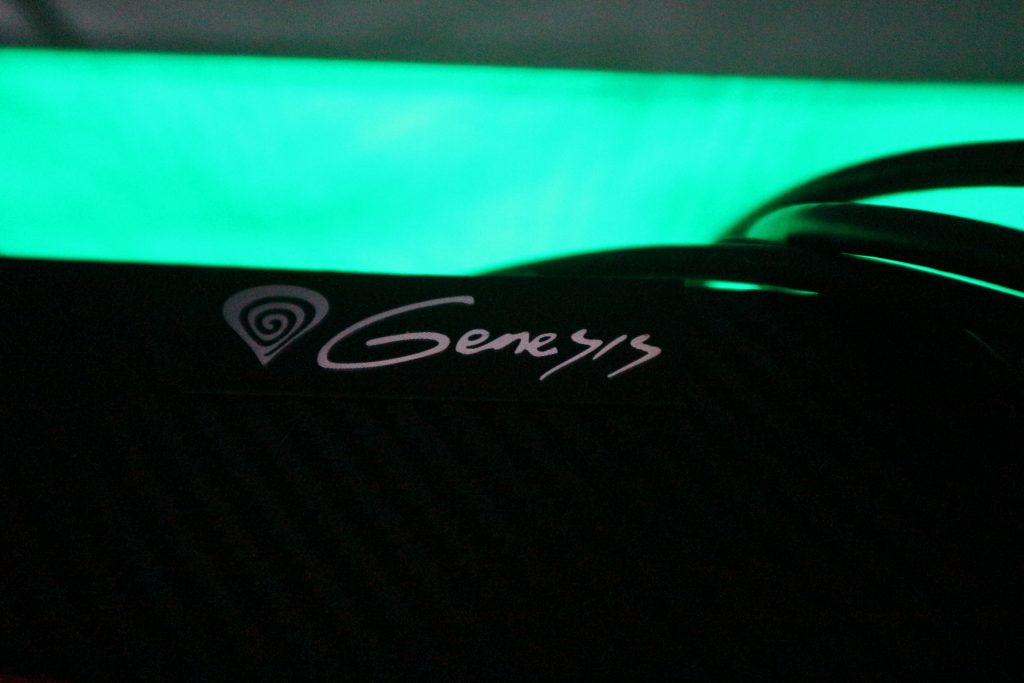 Genesis logo with RGB green lighting in the background