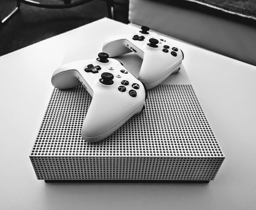Xbox One X with two controllers
