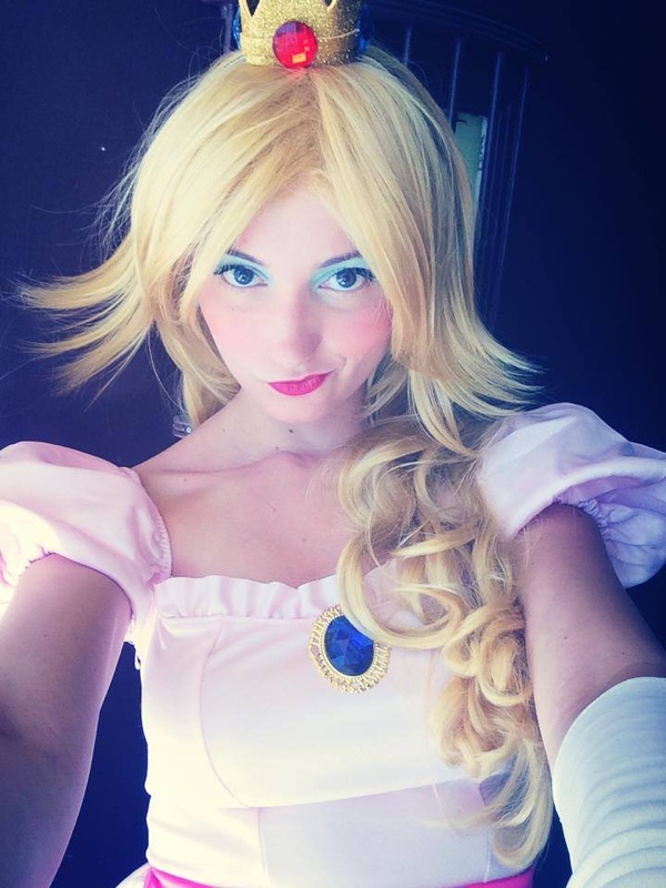 NintendoNat cosplaying as Princess Peach