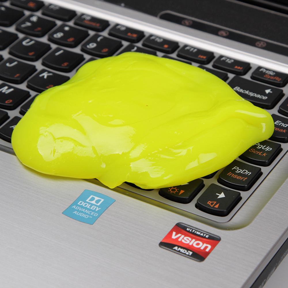 Special gel being used to clean the keyboard on a dirty laptop to clean Computer Hardware