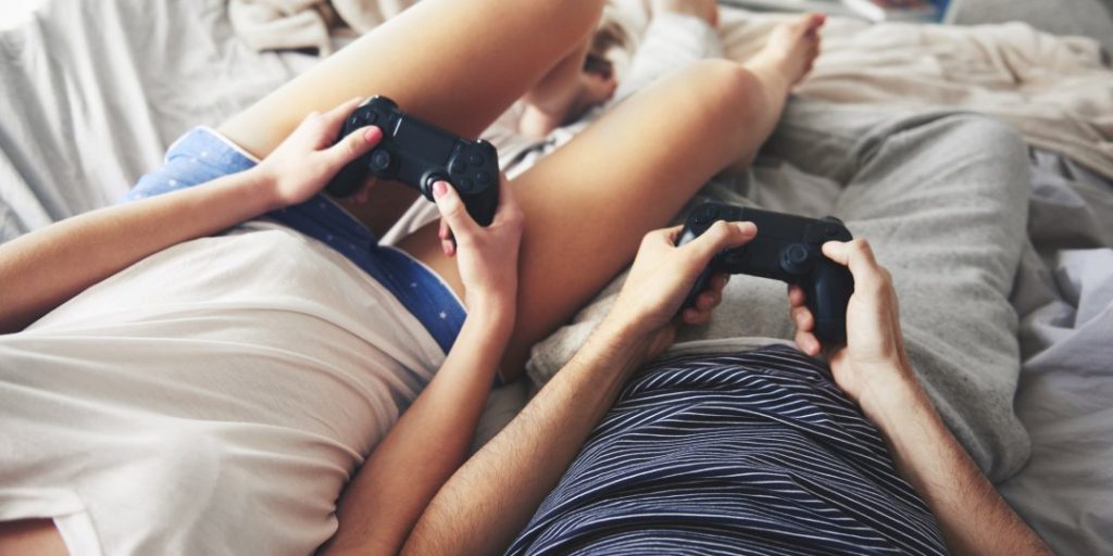 Gamer Couple with PlayStation controllers
