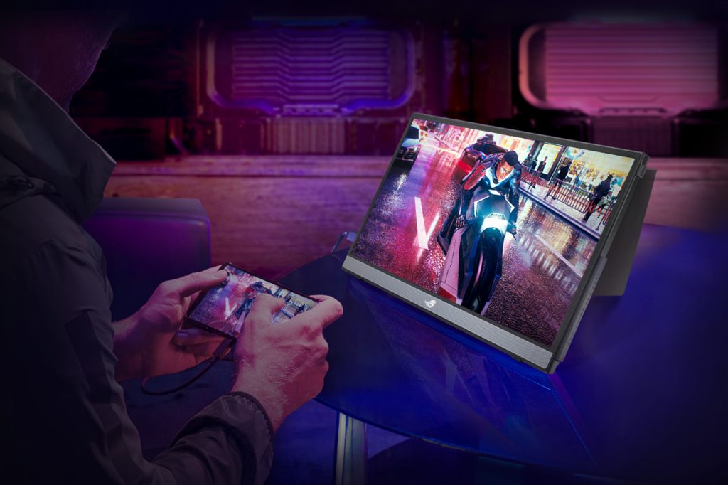 ASUS Republic of Gamers Strix XG16 set up on a coffee table for gaming on the go