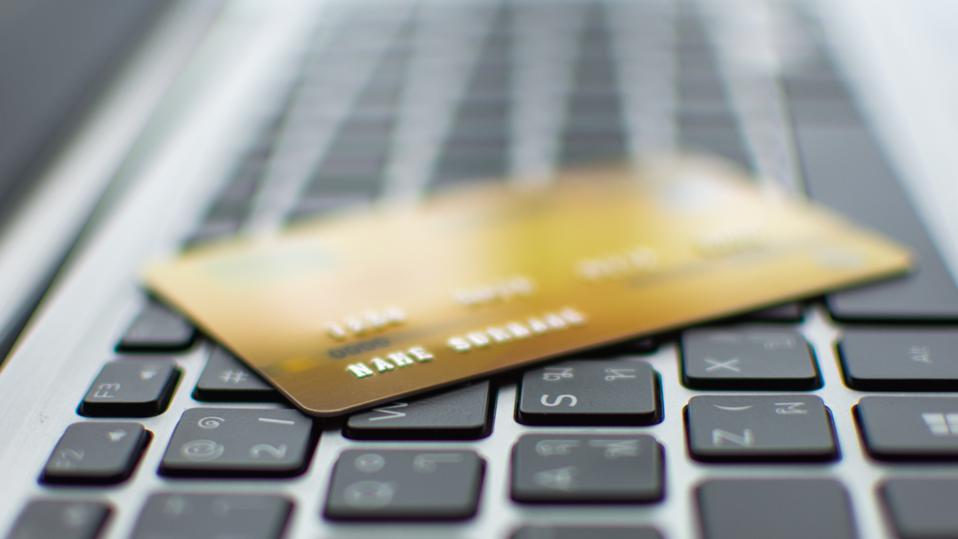 Debit Card for payments lying on a laptop