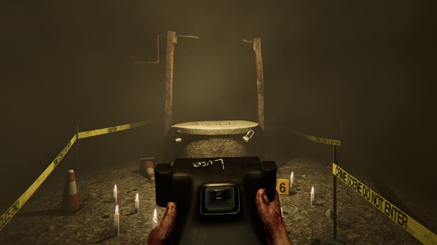 MADiSON gameplay showing Luca holding a camera at a well in the basement