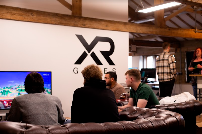 XR Games Studio playing games on couches
