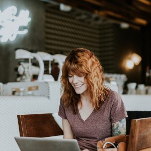 Woman on Laptop possibly playing at online casinos or maybe blogging as a side hustle
