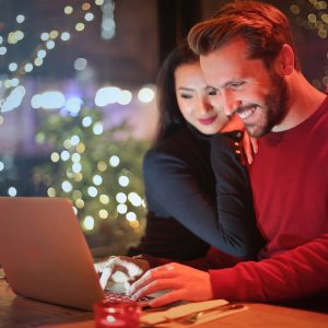Couple on laptop online gambling