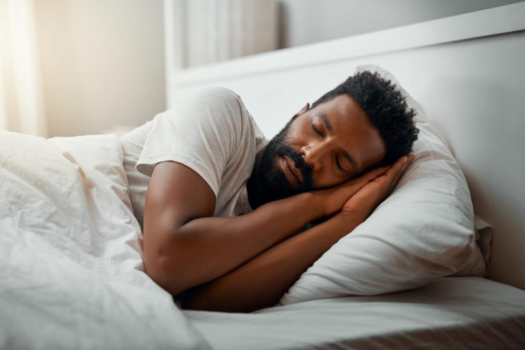Man sleeping which can help combat stress