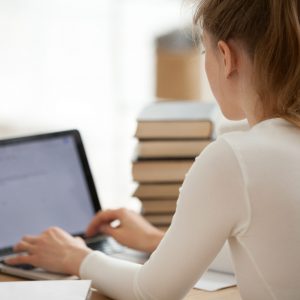 Female studetn writing an essay