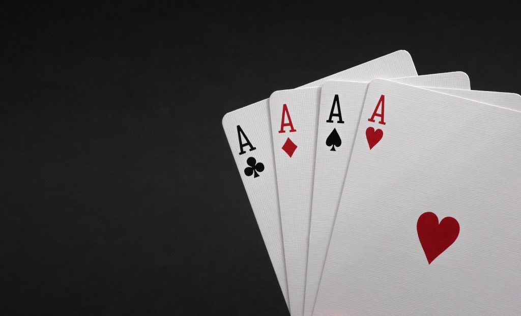 Cards showing four aces for four of a kind in poker