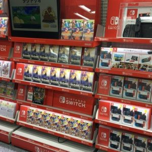 Nintendo wall at a video game retail store showcasing its games and Nintendo Switch console