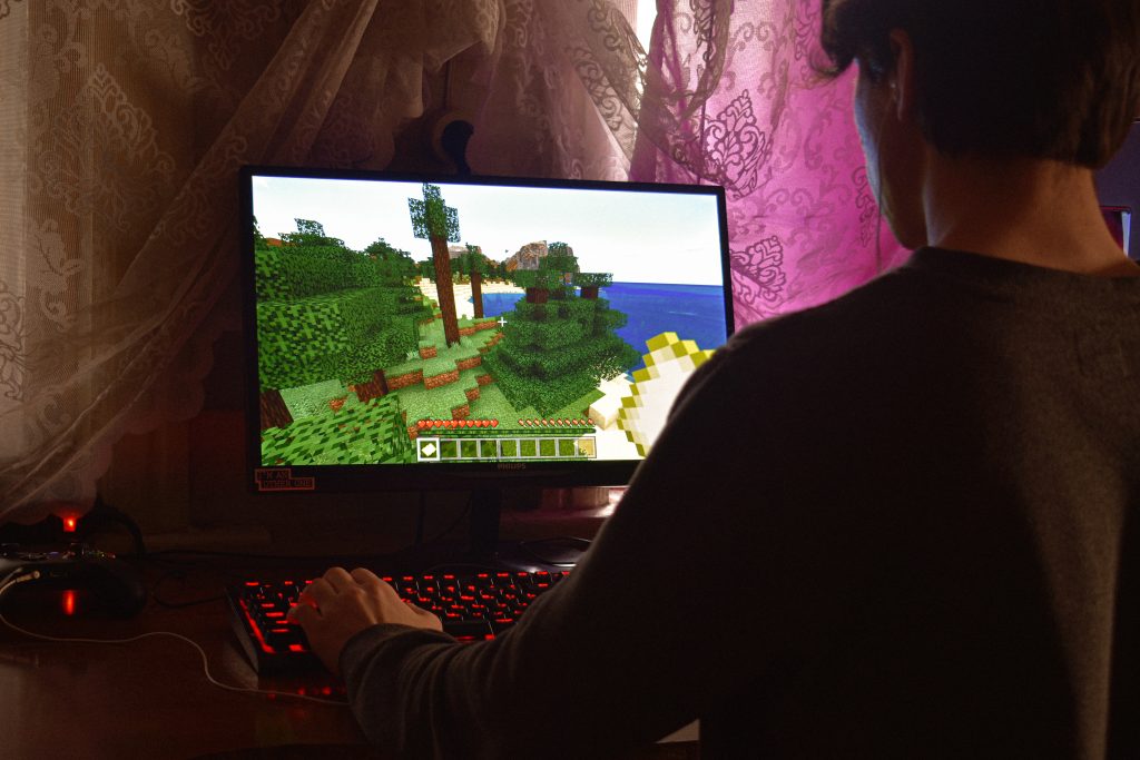 Gamer playing Minecraft on PC