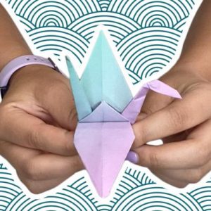 Hands making an Origami crane
