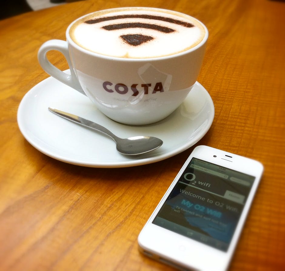 A costa coffee with a WiFi image on top of the foam