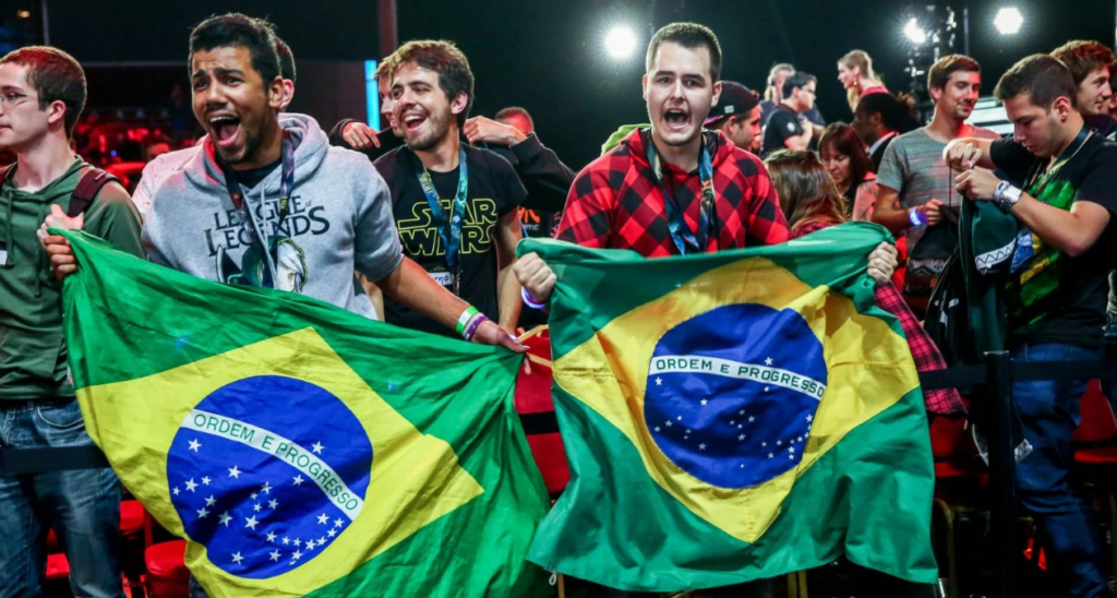 There is a popular Gaming Culture in Brazil as shown by these Brazilian esports fans holding the national flag at an event.