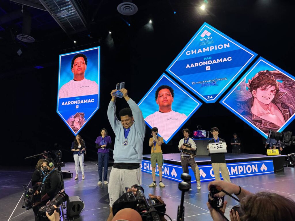 AARONDAMAC lifting the tournament trophy