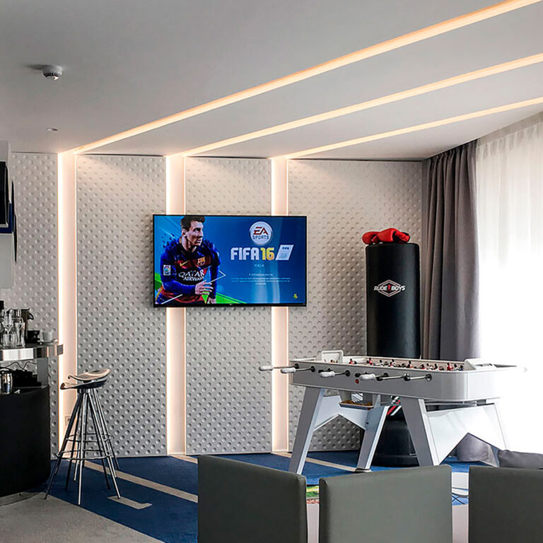 RS Barcelona Robinson Club gaming table next to TV with FIFA on