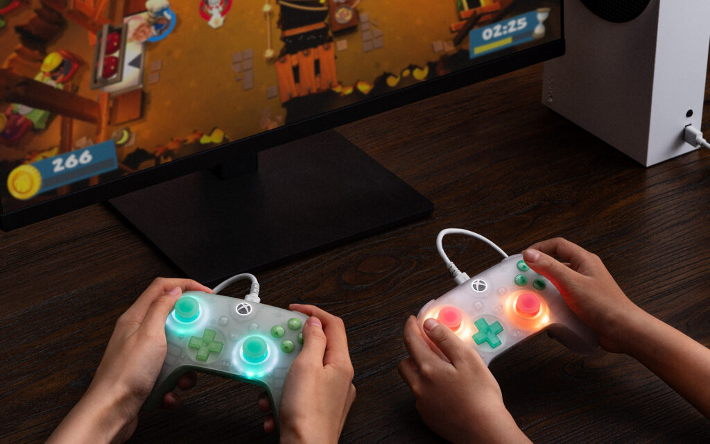 8BitDo Ultimate Mini Wired Controller - Two Being Held