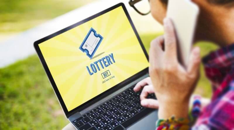 From local lotteries to global jackpots: The Internationalisation of gambling via technology 4 Online Lotteries - Man playing lottery game on laptop