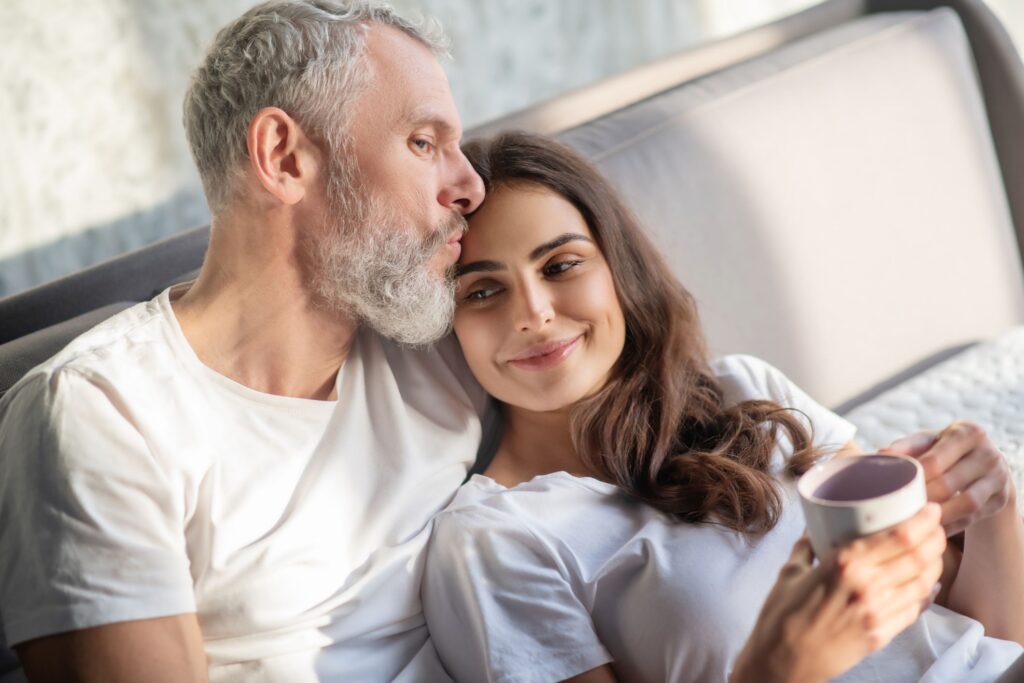 Couple in bed with a significant age gap