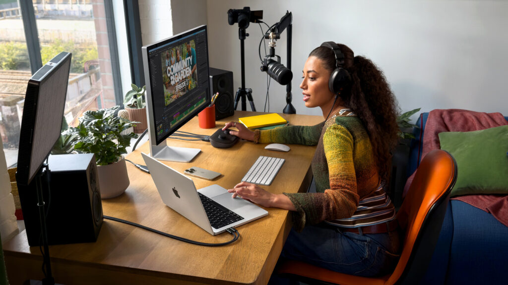 Apple’s new 14-inch MacBook Pro with M5 chip being used by a woman recording a podcast