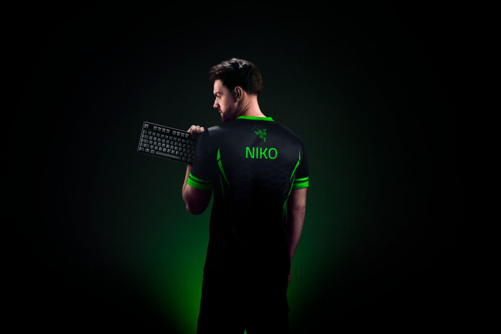 Niko holding a Razer Huntsman V3 Pro gaming keyboard